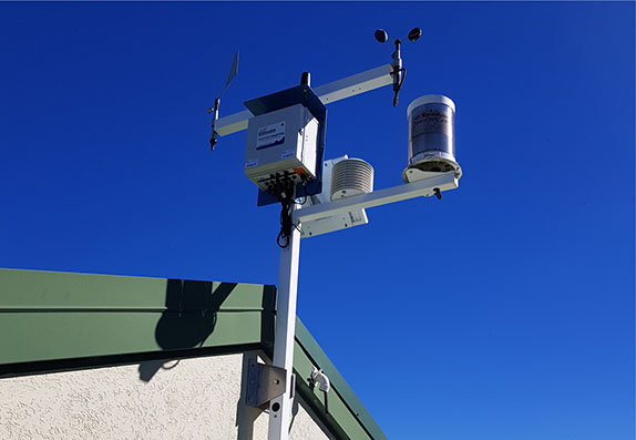Wall-mounted Weather Maestro Weather Station used for monitoring environmental conditions